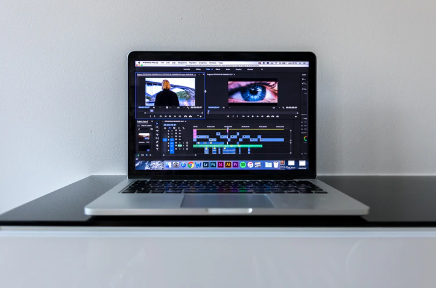 MacBook Pro on black desk photo